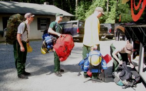 (from left) Adam Keever of Port Penn, Brian McDonald of Bethany Beach, Patrick Gilchrist of Twonsend, and Nikki Testa of Wilmington loaded their gear on a bus before departing for a flight to Alaska to battle a 65,000-acre wildfire.