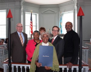Harriet Tubman (as portrayed by Delores Blakey) holding a copy of the Harriet Tubman Day proclamation. Behind her are (from left) Delaware Division of Historical and Cultural Affairs Director Tim Slavin; the Rev. Rita Mishoe Paige, pastor of Star Hill African Methodist Episcopal Church in Dover; Ann Gravatt from the Delaware Department of Transportation; Chief Deputy Secretary of State Rick Geisenberger; and state Rep. Donald Blakey.