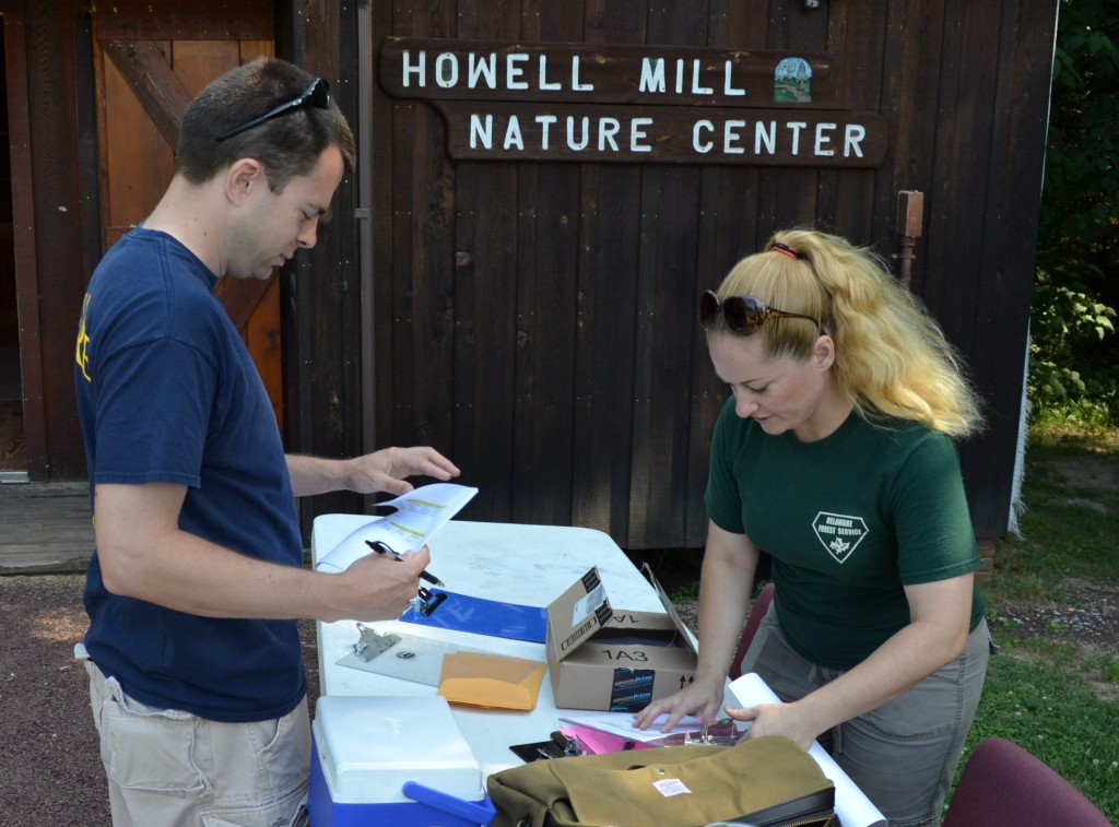 From left, statewide FFA forestry coordinator Scott Haldeman of Milford meets with Delaware Forest Service education specialist Ashley Peebles before the annual forestry challenge at Camden's Brecknock Park. 