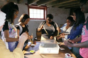 Delaware State University freshmen participating in a paper-marbling training session at the John Dickinson Plantation.