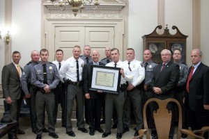 (L to R) Pictured are: Rep. Steve Smyk, Agent George Merrill, Agent Trey Moore, Lt. James Diana, Deputy Director Robert Kracyla, Agent Thomas Mason, Gov. Jack Markell, Director John Yeomans, Lt. Kevin Jones, Agent Daniel Duke, Agent Aaron Bonniwell, Rep. William Carson, Agent Michael Loiseau and DSHS Secretary Lewis D. Schiliro.