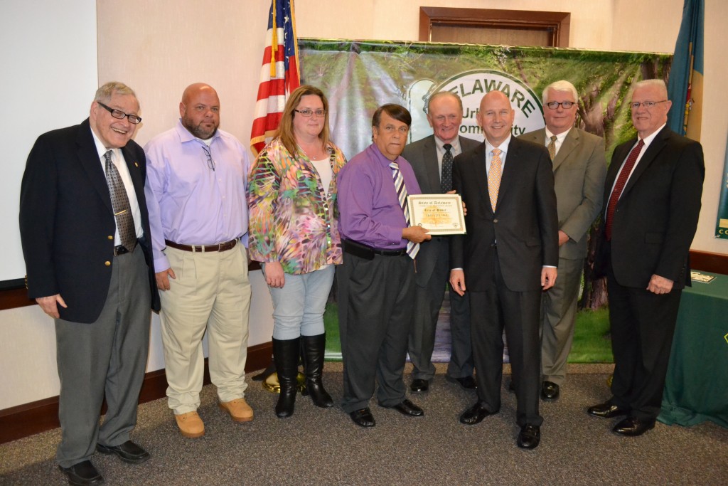 From left, Dover City Councilman Fred Neil, Grounds Supervisor George Jamar, Public Works Director Sharon Duca and Dover Mayor Robin Christiansen accept an award recognizing the City of Dover as a Tree City USA for 27 years, the longest run of any municipality in the First State. Congratulating them are Rep. David L. Wilson, Secretary of Agriculture Ed Kee, Governor Jack Markell, and Rep. Harvey Kenton. 