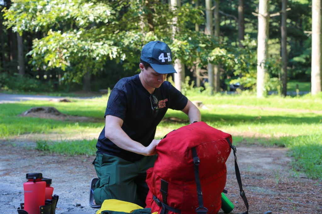 Allen Austin Gardner-Bowler of Milford, a rookie making his first trip with a Delaware wildfire crew, packs his gear. 