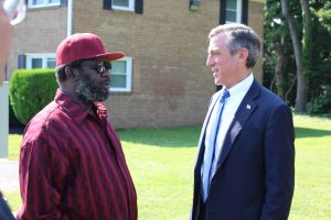 Governor Carney speaks with U.S. Marine Corps veteran Gregory Larry of Wilmington, who moved into an apartment at the Summit at Middleboro Crest in February after experiencing homelessness, working through the VA and Connections CSP. 