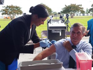 Governor John Carney getting his annual flu shot from DHSS Secretary Dr. Kara Odom Walker