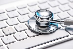 Image of a stethescope on top of a keyboard