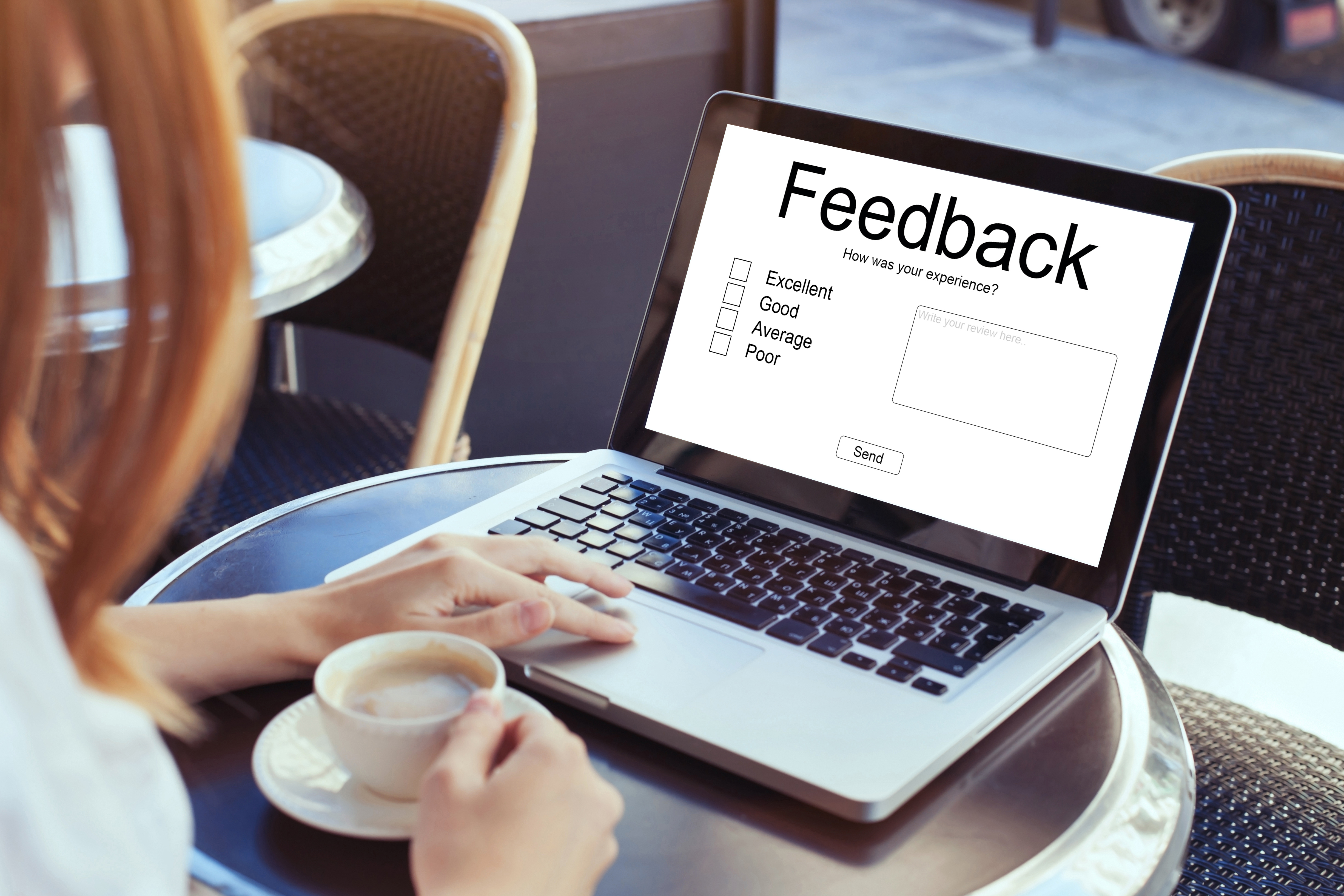 person at computer providing feedback to survey