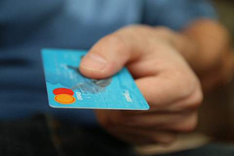 Photo person holding debit card