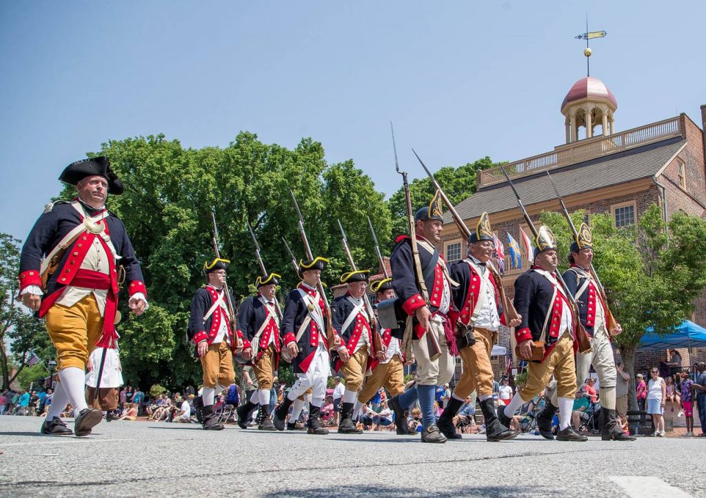 Photo of the a scene in front of the New Castle Court House Museum as part of a previous Separation Day parade.