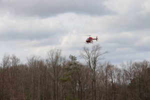 A helicopter contracted by DNREC Mosquito Control sprays for Woodland Pool mosquitoes