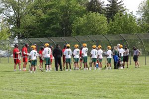 In this photo, Ferris School and Polytech players and coaches get ready for their game in May.