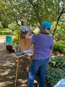 Photo of a member of the Sunshine Plein Air Artists painting on the grounds of Buena Vista