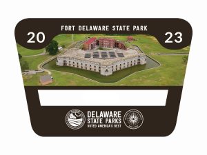 An overhead view of Fort Delaware State Park on Pea Patch Island set on a black background with Fort Delaware State Park and Delaware State Parks written in white text and a white space for the a numbe to indicate who this annual pass belongs to.