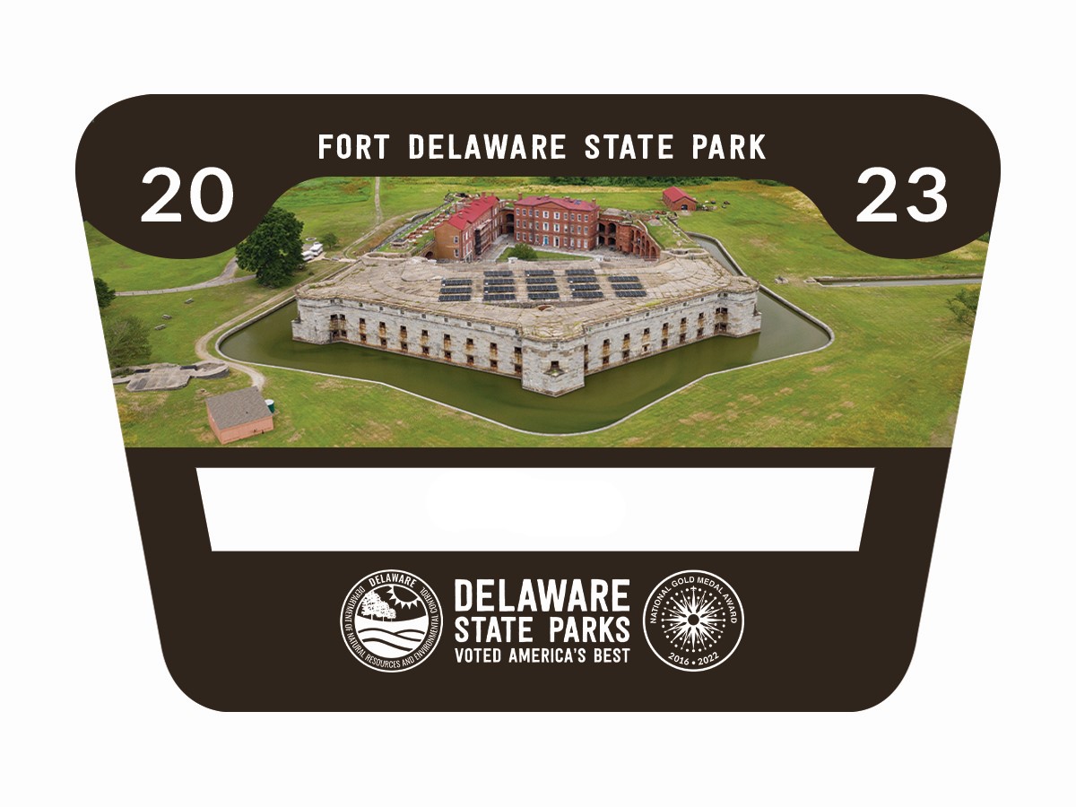 An overhead view of Fort Delaware State Park on Pea Patch Island set on a black background with Fort Delaware State Park and Delaware State Parks written in white text and a white space for the a numbe to indicate who this annual pass belongs to.
