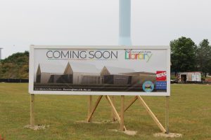 Sign that reads "Coming soon, Harrington Public Library"
