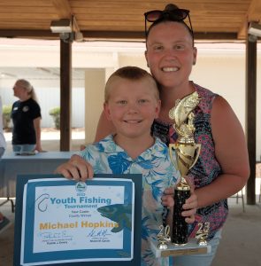 Youth Fishing Tournament New Castle County winner Michael Hopkins, with his proud mom, Courtney Hopkins. /DNREC photo