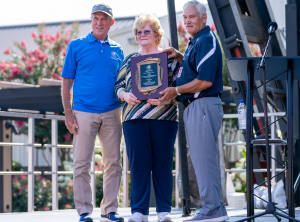 Secretary of Agriculture Michael T. Scuse and Governor Carney present Kitty Holtz with the Secretary's Award for Distinguished Service to Agriculture during Governor's Day at the Delaware State Fair.