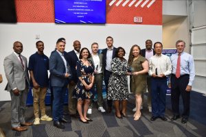 Group picture of Business Owners of 5 small businesses that won in the STEM Category for the EDGE Grant. Also shown are DSB Director Regina Mitchell, DOS Deputy Secretary Kristopher Knight and Governor John Carney. 