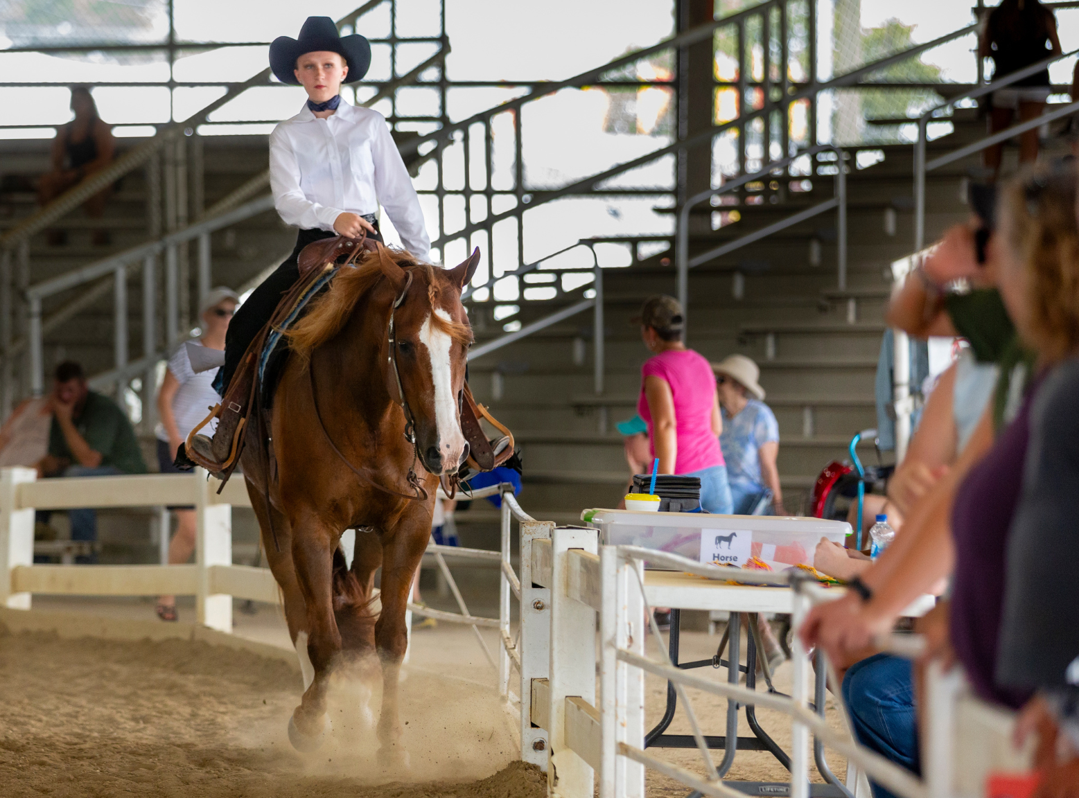 Youth horse exhibitor at the 2022 Delaware State Fair performs a pattern in a Western class.