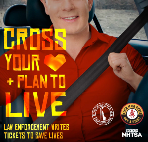 Photo of a man buckling up with text that says "Cross your heart and plan to live. Law enforcement writes tickets to save lives. Delaware Office of Highway Safety logo, Click it or Ticket logo, and NHTSA logo.