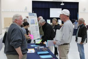 Visitors to an informational meeting learn about the state Energy Plan update.