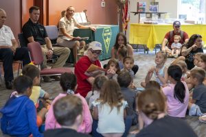 Delaware's First Lady, Tracey Quillen Carney, read to the children at the Dover Public Library during Smokey Bear's 80th Birthday Celebration.