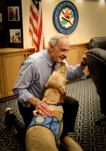 Senator Carper and Facility Dog, Ajax.