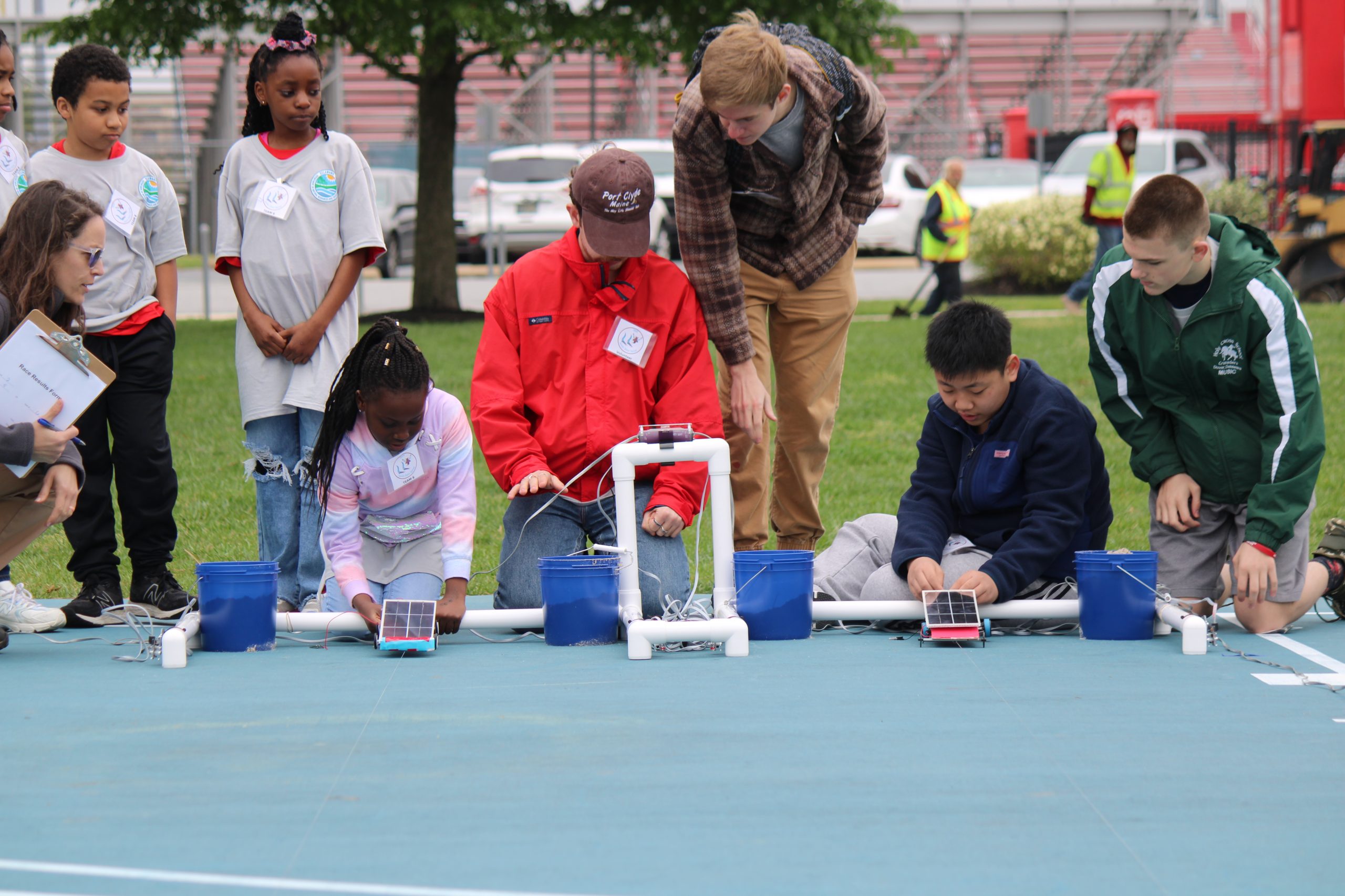 Students race their solar vehicles in the 2024 Junior Solar Sprint.