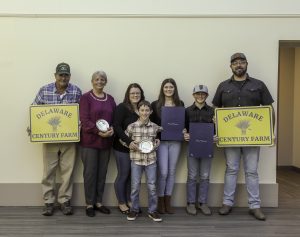 Picture (L to R): The Beauchamp Family, including Brian, Lori, Morgan, Milo, Mikayla, Mason, and Mike, accepted two Century Farm Awards for their farms in Harrington and Greenwood, DE.