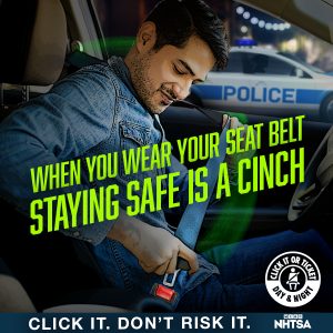 Man buckling up with text that reads "when you wear your seat belt, staying safe is a cinch" click it don't risk it