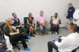 Governor Meyer sits across from students in the Del Tech cannabis training program.