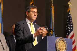 Governor Meyer stands at a podium.