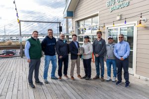 Leaders from DNREC and the Division of Parks and Recreation present an award from the National Association of State Park Directors Big Chill Beach Club in recognition of their contributions to Delaware State Parks and the community. Pictured l to r are Brooks Cahall (Parks Environmental Program Administrator), Big Chill Owners Joseh Grapski and Mitch Rosenfeld, DNREC Secretary Greg Patterson, Big Chill Manager Becca Anderson, Matt Garbutt and Rich Garrahan of La Vita Hospitality and Park Superintendent Scott Borino.