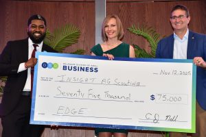 Nichole Krambeck's Insight Ag Scouting business was honored with an Entrepreneur Award at Wednesday night's Delaware Division of Small Business’ EDGE 2.0 grant competition award ceremony in Newark. At right is Delaware Gov. Matt Meyer. At left is Delaware Division of Small Business Director CJ Bell. Photo by Delaware Division of Small Business.
