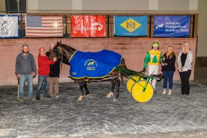 Watch Em Win won a $110,000 DSBF Final in a stakes record tying 1:51.2 on Thursday at Bally's Dover.