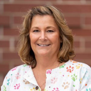 Headshot of Donna Ward, smiling at the camera.