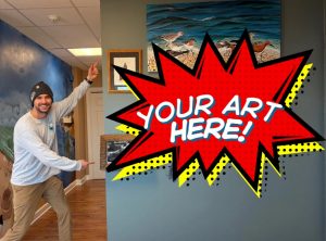 Staff from the DuPont Nature Center gesturing to the open wall for the contest display with the words, "Your artwork here."