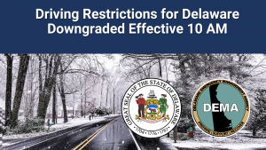 Snowy, wintry road with black ice and DEMA, state logos