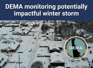 Image of snow covered town and DEMA logo