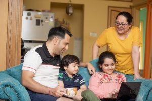 Smiling Family inside living room
