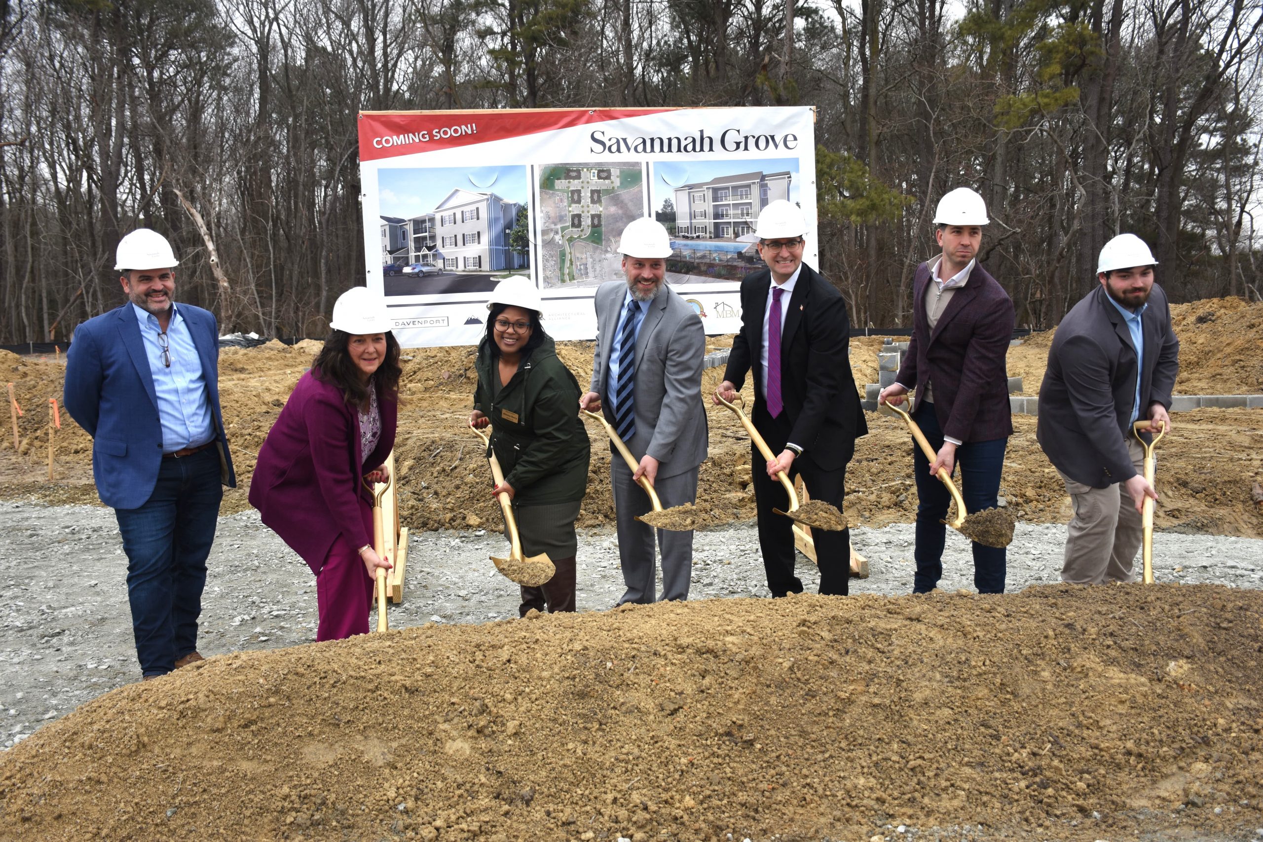 State leaders celebrating the groundbreaking of Savannah Grove with a traditional dirt toss.