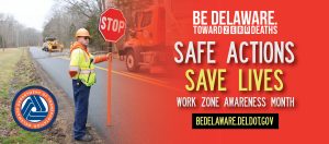 Construction worker holding a sign to direct traffic with the Work Zone Safety Awareness Week Slogan - Safe Actions Save Lives in large letterting
