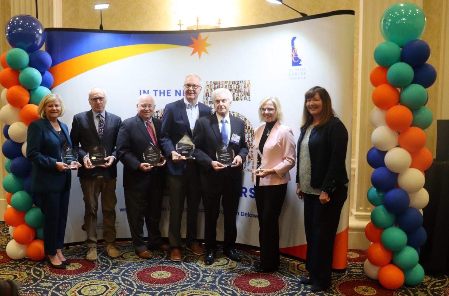 Recognition and awards ceremony honoring leaders in cancer prevention and control. Pictured from left: Deborah P. Brown, CHES; James E. Spellman, MD, FACS, FSSO; Stephen Grubbs, MD, FASCO; William W. Bowser, Esq.; Nicolas J. Petrelli, MD, FACS; Bethany Hall-Long, BSN, MSN, PhD; and Dava Newman, Deputy Cabinet Secretary, Delaware Department of Health and Social Services. Not pictured: John Carney, Mayor of the City of Wilmington and 74th Governor of the State of Delaware, who was also honored.