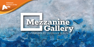 Promotional graphic for the Mezzanine Gallery featuring the Delaware Division of the Arts logo in the upper left and the text “Mezzanine Gallery: Exhibitions by Delaware Artists” centered over a textured abstract blue-and-gray painted background.