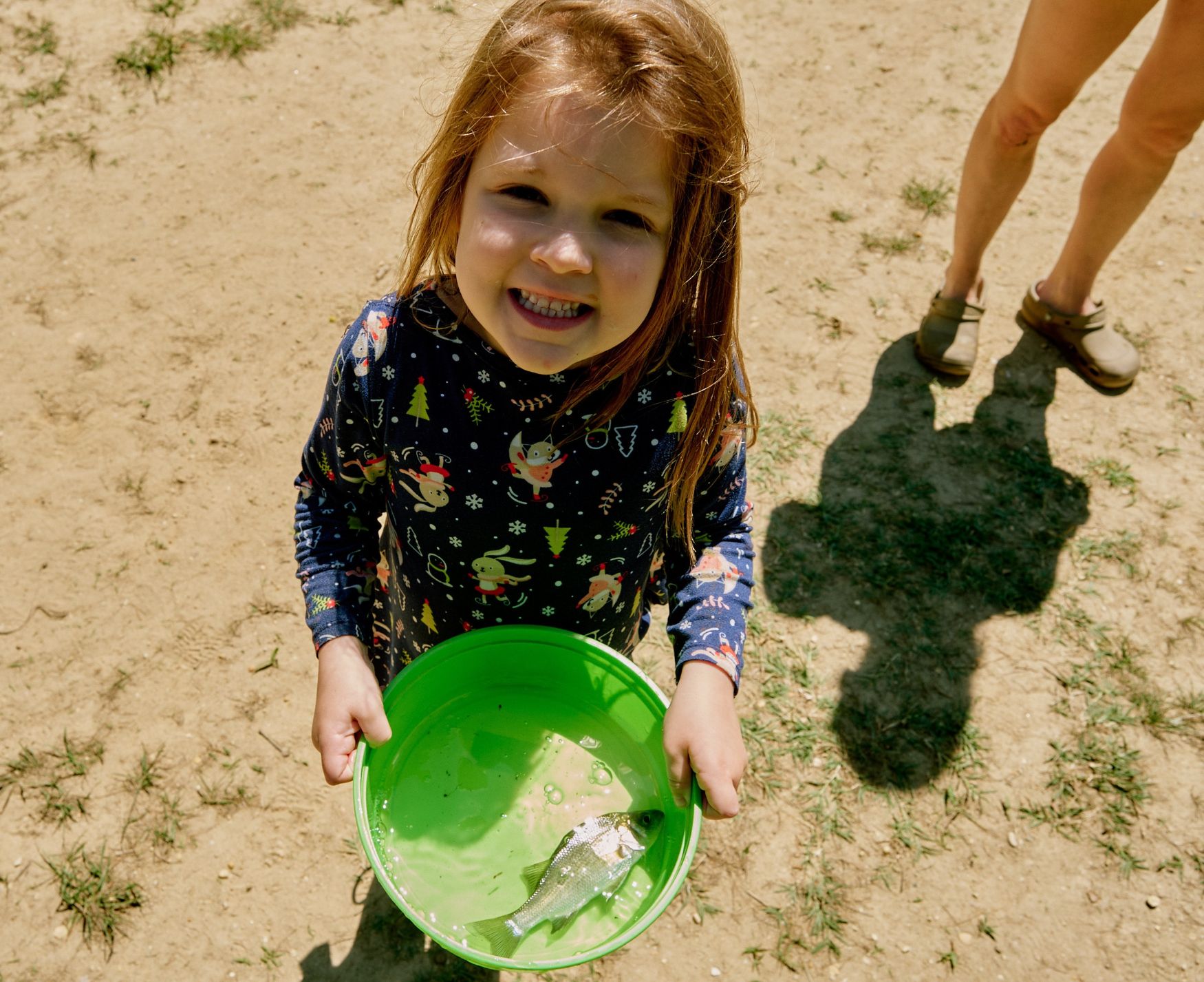 A Delaware Youth Fishing contestant proudly shows off her catch at an earlier tournament. /Delaware DNREC photo