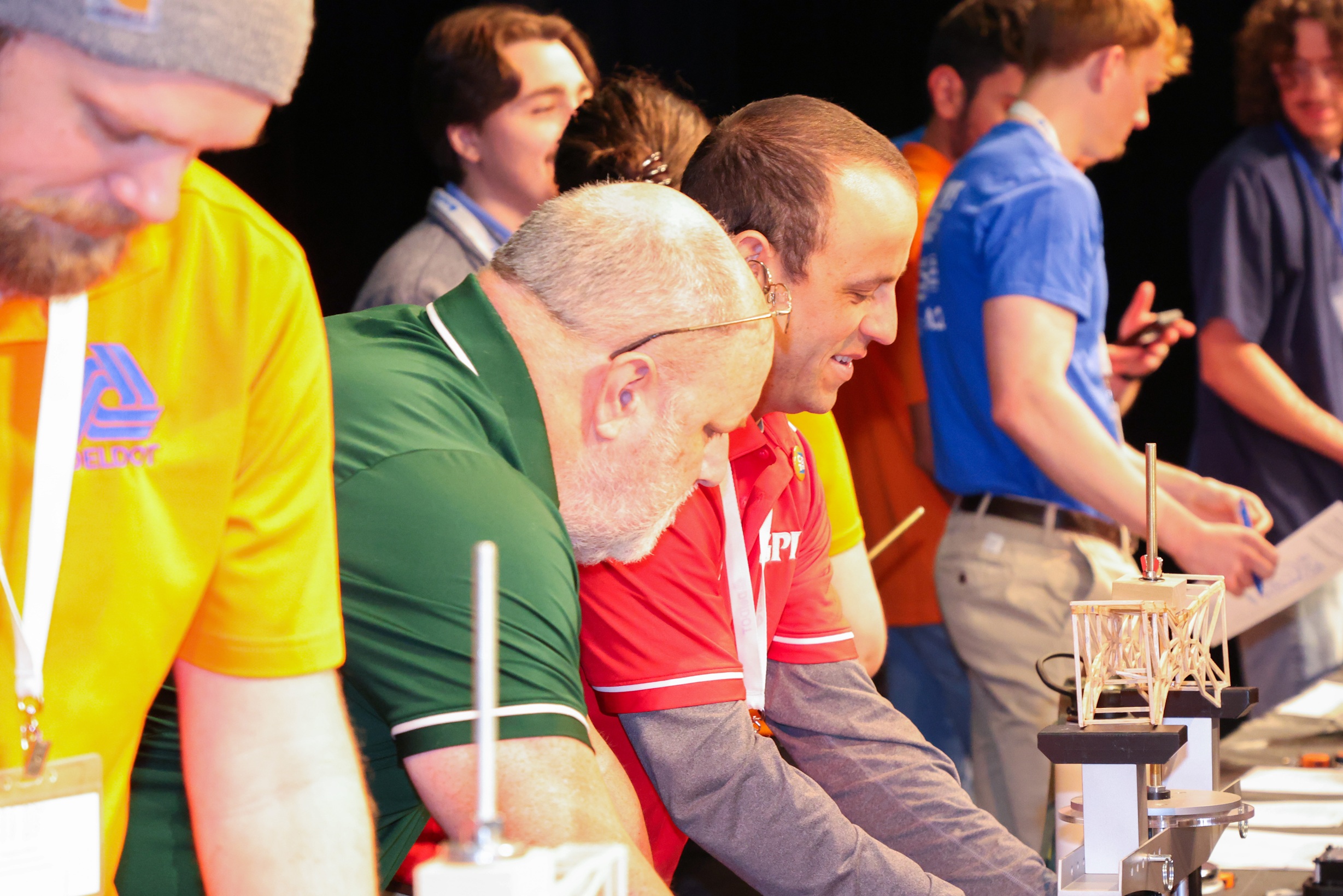 Group of Bridge Design Competition Volunteers testing the weight of bridges designed by the students.