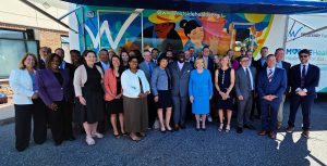 Attendees of the announcement of the new Delaware Medical School take a group photo at Westside Health in Dover