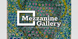 Abstract portrait composed of hundreds of hand-drawn circular marks in blue, green, yellow, pink, and black. A loosely outlined face and shoulders emerge from the dense pattern, with a yellow halo-like ring arcing around the head against a white background.
