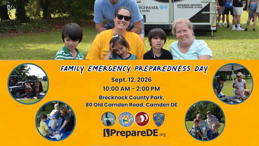 Group of smiling adults and children at a park promoting Family Emergency Preparedness Day in Camden, Delaware.
