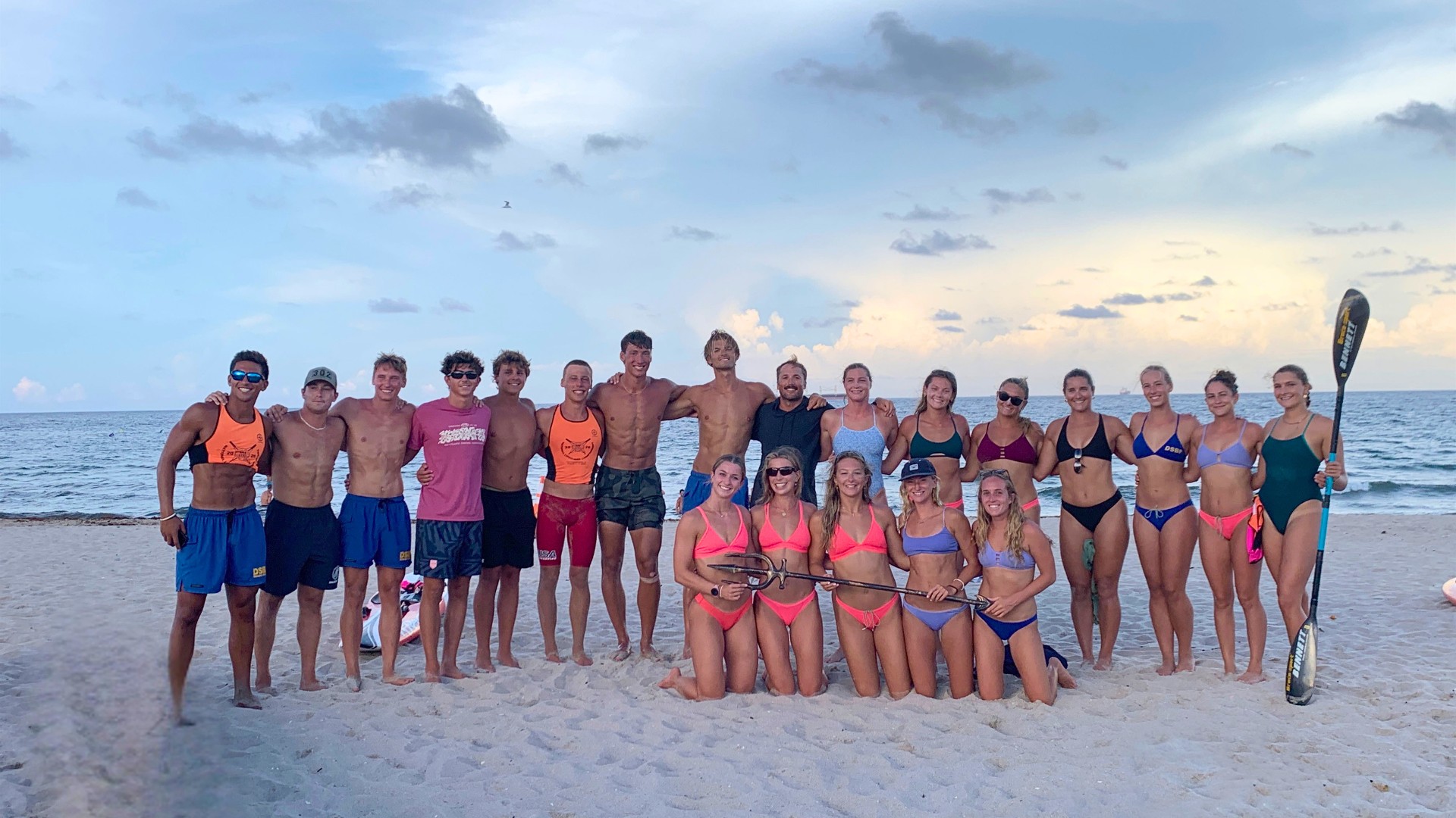 The Delaware Beach Patrol poses on a Fort Lauderdale beach following their third consecutive national championship title as part of the Sussex County Lifesaving Team.